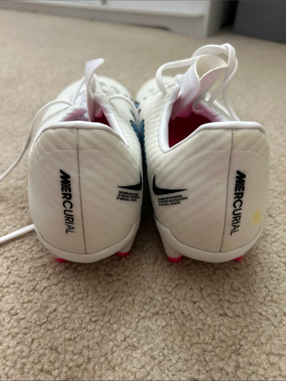 Nike Women's White Soccer Cleats with Blue Graphics and Pink Insole